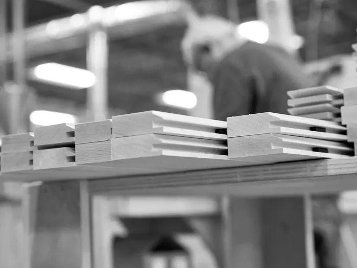 A stack of finished door parts ready to ship