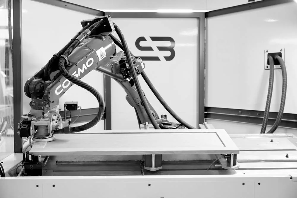 Robotic sander finishing a five-piece door on the line